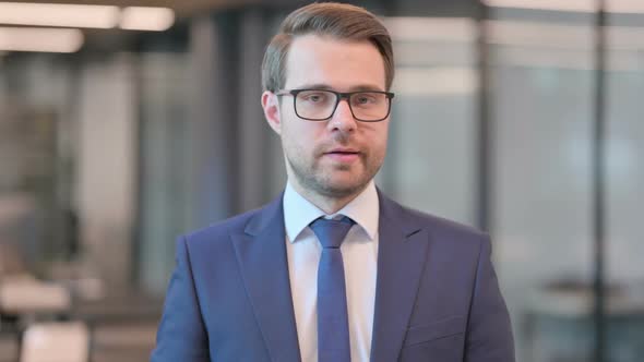 Portrait of Businessman Shaking Head as No Sign