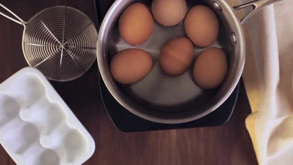 Boiling organic eggs for deviled eggs recipe.