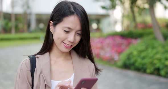 Young Woman use of mobile phone for online