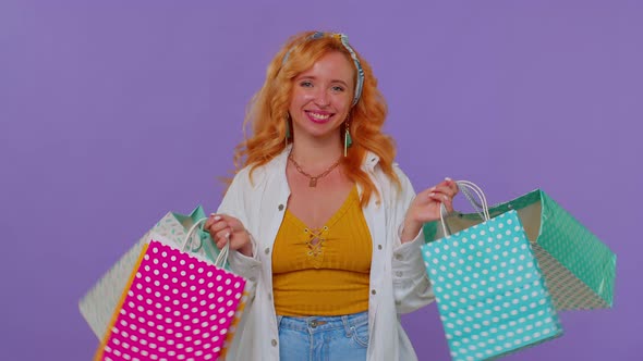 Girl Showing Shopping Bags Advertising Discounts Low Prices Shopping on Black Friday Holiday