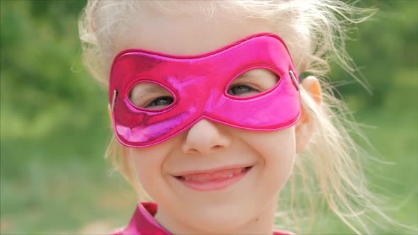 Beautiful Llittle Girl in the Superhero Costume, Close Up Portrait Child in the Mask of the Hero