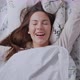 Woman Touching Hair on Bed in Morning - VideoHive Item for Sale