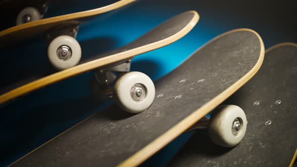 An endless row of overlapping skateboards stacked together in studio light. 4KHD