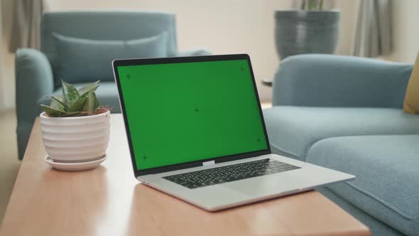 Laptop With Green Screen Mock Up Display At Home Living Room