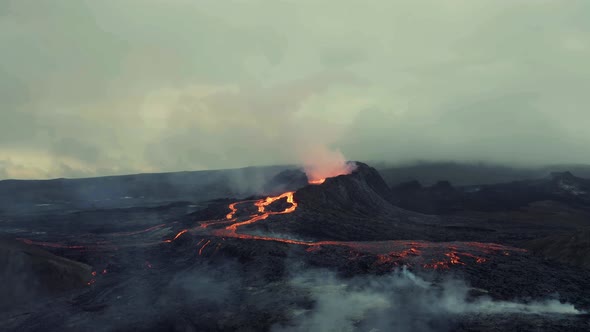 Drone Flying Towards An Erupting Volcano - aerial shot