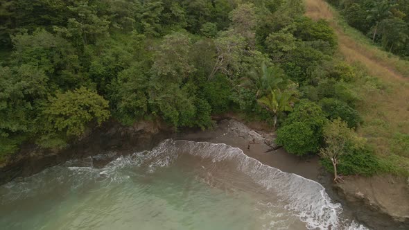 beautiful top down view over a sandy beach on the shores of the pacific ocean at costa rica