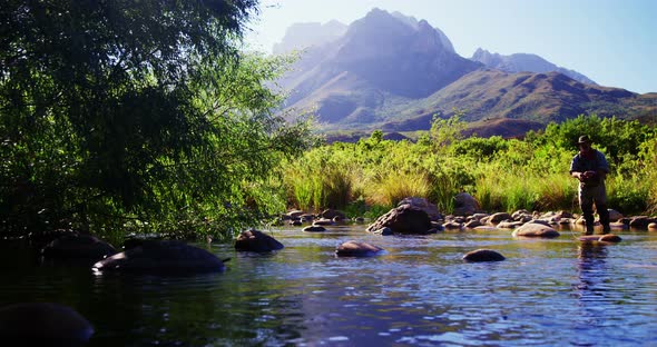 Man fly fishing in river