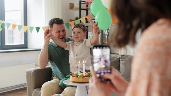 Family with Birthday Cake Photographing at Home