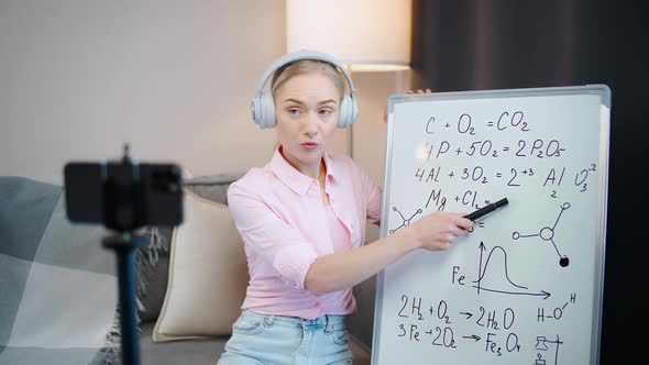 Woman Chemistry Teacher Conducts a Lesson Online Live Broadcast of the Learning Process Using a