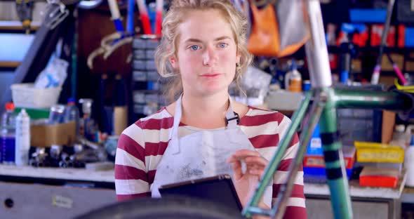 Woman using digital tablet at workshop 