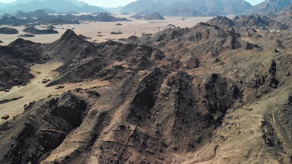 Day top view of the Sahara desert, desert mountains. Sands.