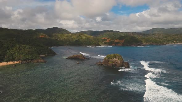 Seascape with Tropical Island, Rocks and Waves. Catanduanes, Philippines