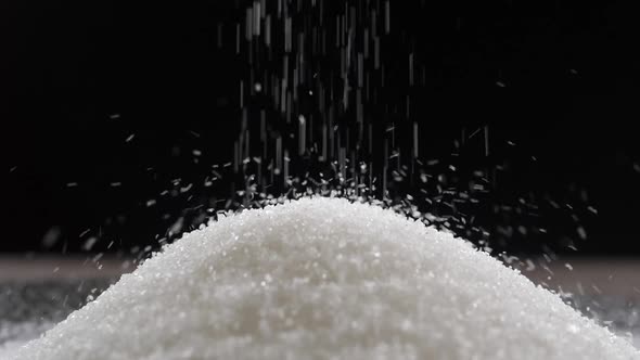 a mound of sugar on a black background