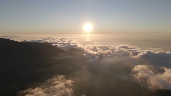 Beautiful aerial view above the clouds on sunset. Gomismta, Georgia