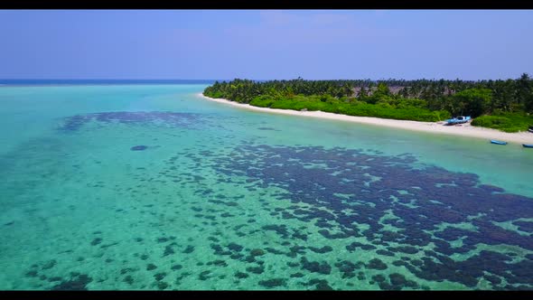 Aerial scenery of relaxing island beach journey by aqua blue lagoon and white sand background of a d