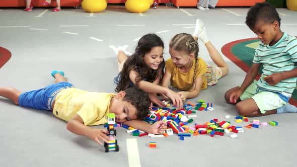 Funny Kids Playing Colorful Toys Indoor