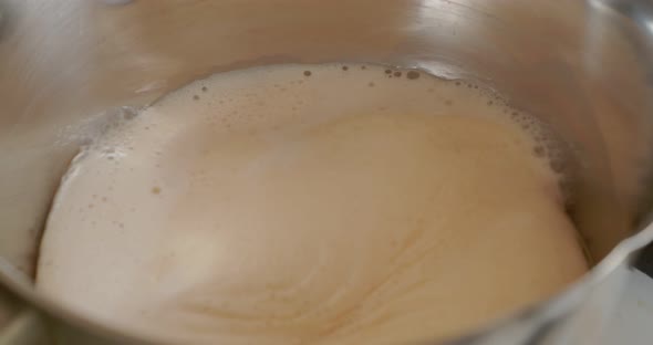 The Melted Milk Boils in the Pan