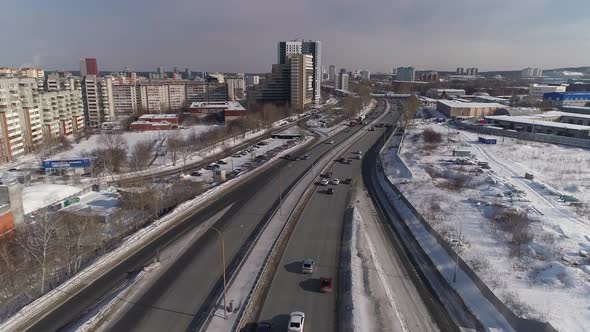 Aerial view of Highway and multi-storey buildings in the winter city 08