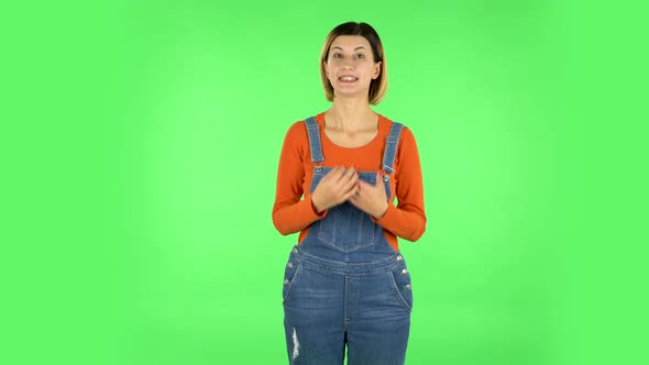 Smiling Girl Makes Sign Ok. Green Screen