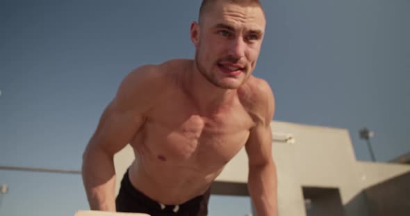 Sportsman Doing Push Ups on Bars