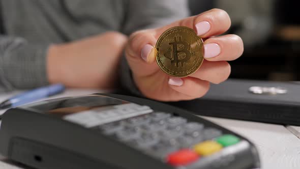 Closeup Woman Holding Gold Bitcoin Coin Near Terminal Cryptocurrency Concept