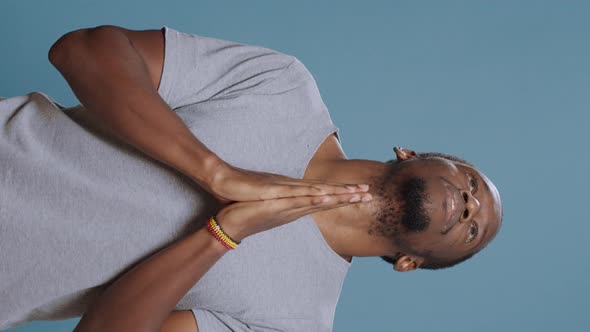 Vertical Video Male Model Holding Hands in Prayer to Do Spiritual Session alt