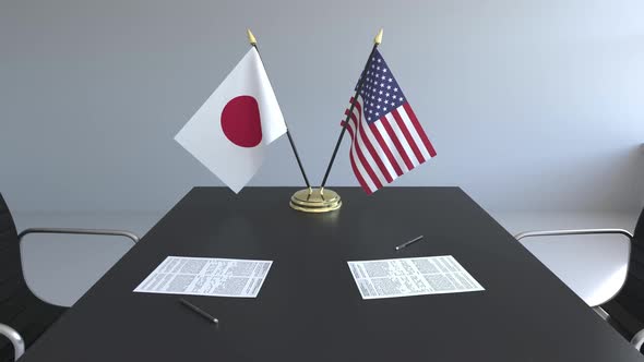 Flags of Japan and the United States on the Table alt