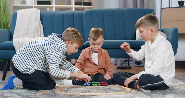 Brothers Had Gathered Car Track on the Floor at Home and Giving High Five Each