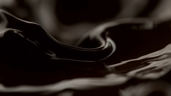 Super Slow Motion Shot of Waving Melted Dark Chocolate at 1000 Fps