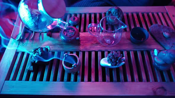 Traditional Tea Making on Board for Tea Ceremony By Neon Lighting