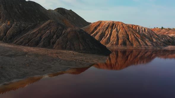 Aerial View of a Landscape Similar To the Planet Mars with Red Hills and Rivers with Red Water