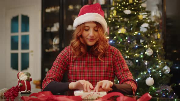 Young girl makes Christmas box