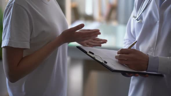 Doctor Recording Patients Complaints in Card, Girl Complaining of Pain in Chest