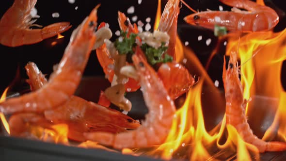 Super Slowmotion Footage of Throwing Fresh Prawns and Seasoning on Ignited Pan, 1000Fps 