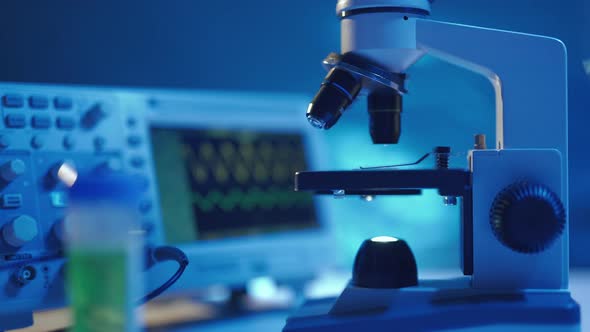 Close Up of a Optical Scientific Microscope in Laboratory alt