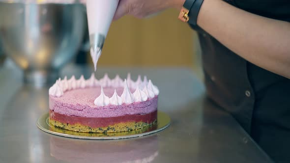 Confectioner Decorates Cake and Conducts Cooking Lesson