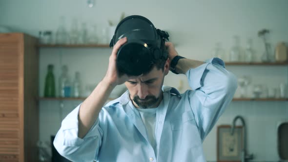 Man Puts on Respirator To Protect Himsdelf From Coronavirus