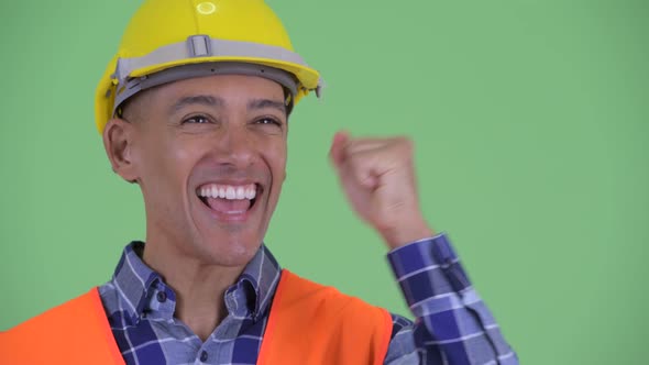 Face of Happy Multi Ethnic Man Construction Worker Getting Good News