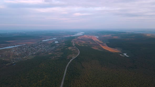 Aerial View of Picturesque Forests with a Highway That Crosses Woods