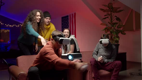 Group of Young Friends Playing Virtual Videogame