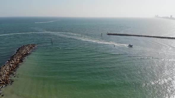 Yacht arriving at gulf shores Alabama USA ocean aerial