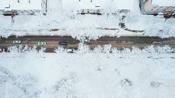 Aerial Top Down View of Snowy City Asphalt Road Landscapes in Winter