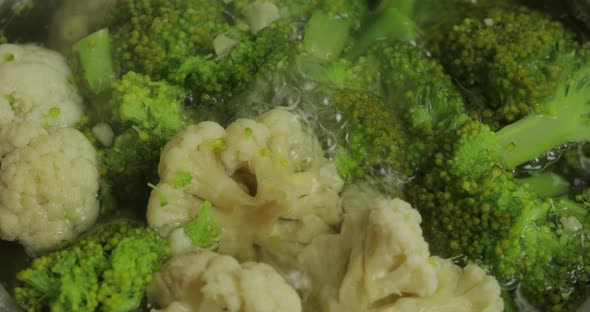 Cooking Colorful Broccoli and Cauliflower in the Pan with Boiling Water