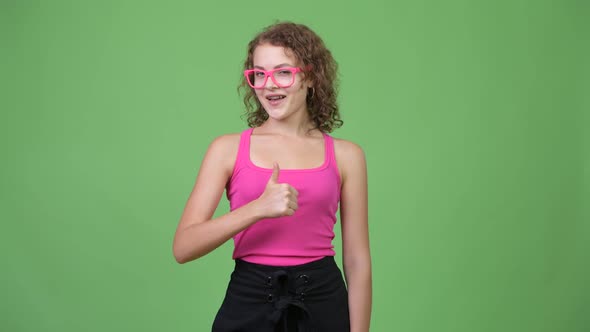 Young Happy Beautiful Nerd Woman Giving Thumbs Up