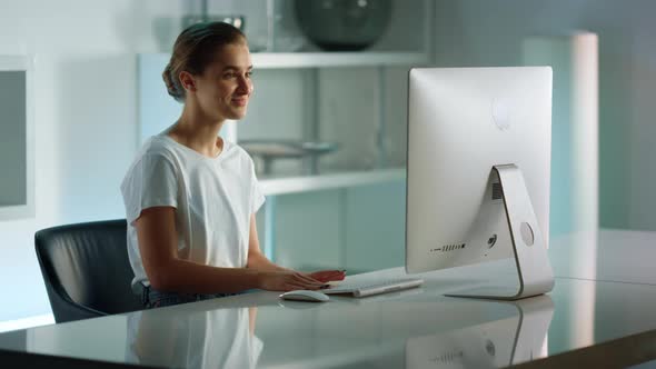 Smiling Student Videocalling Family Enjoying Virtual Meeting in Home Office