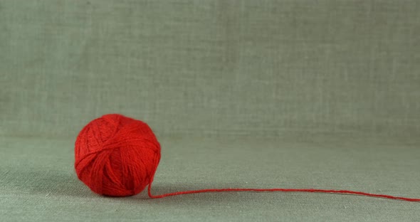 Yarn ball rolling. 