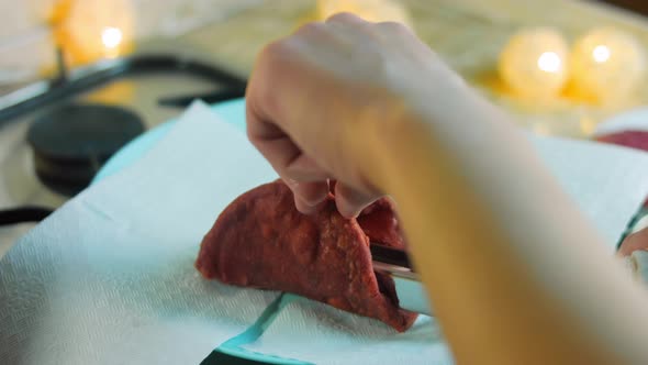 The Chef Bakes Red Tortillas in a Bowl with Oil