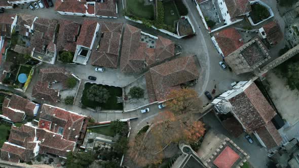 Roofscape Of Ancient Village And Medieval Castle With Dense Forest Hilltop In Obidos, Portugal. - Ae