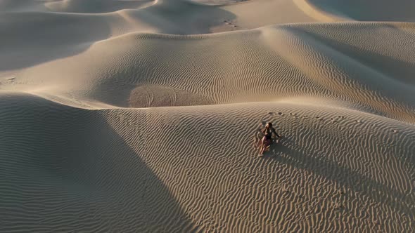 Woman is Posing in the Middle of the Desert Lying on Sand Great Sandy Desert