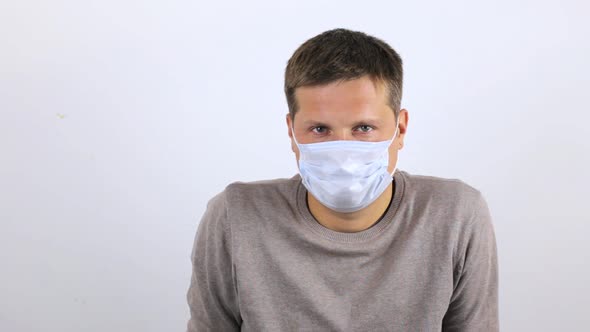 A Young Man Is Waiting for an Appointment with a Doctor